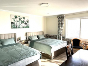 Spacious Bedroom with Two Queen Sized Beds